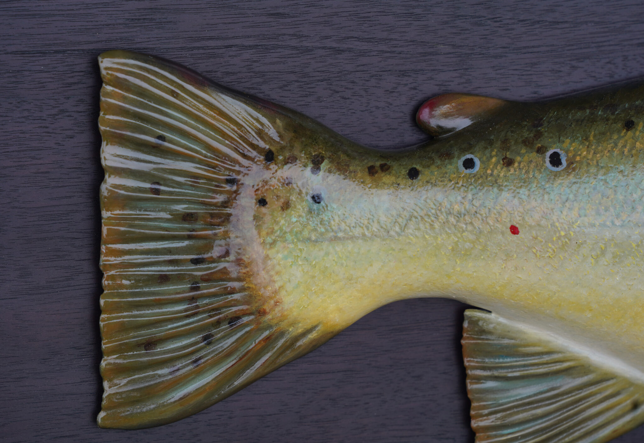 A close-up shot of Gold color Fish tail