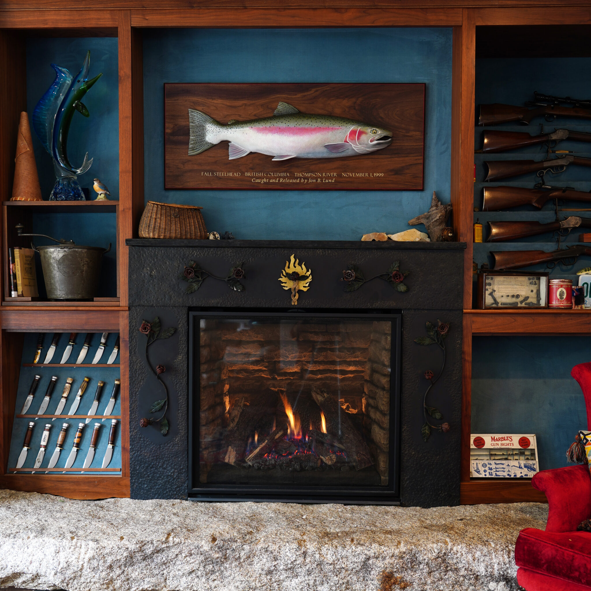 Steal head fire place with fish design on background